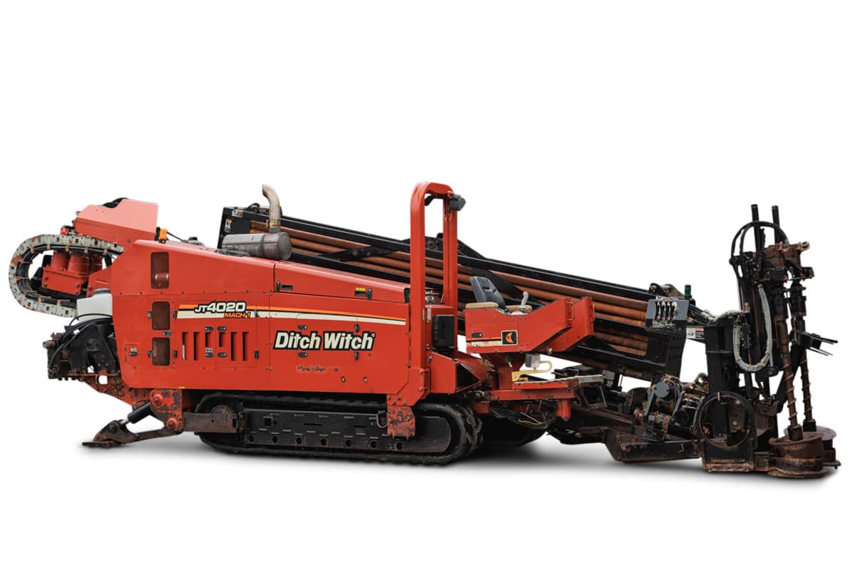 Ditch Witch JT4020 MACH 1 horizontal directional drill, side profile showing tracks, engine housing, and drill pipe rack.