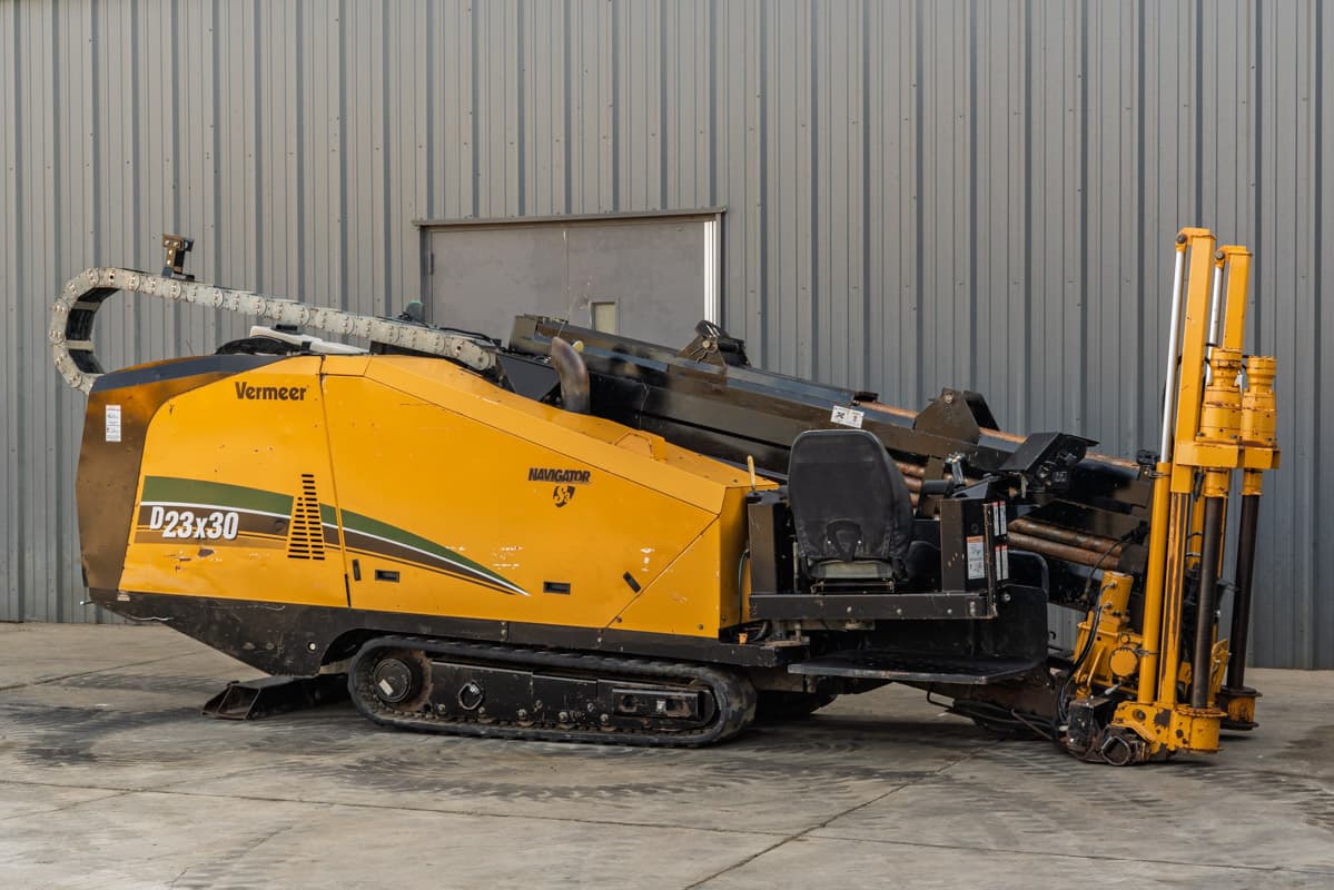 2016 Vermeer D23x30 S3 HDD drill, side view, rubber tracks, operator seat, drill frame, pipe rack, cable carrier visible