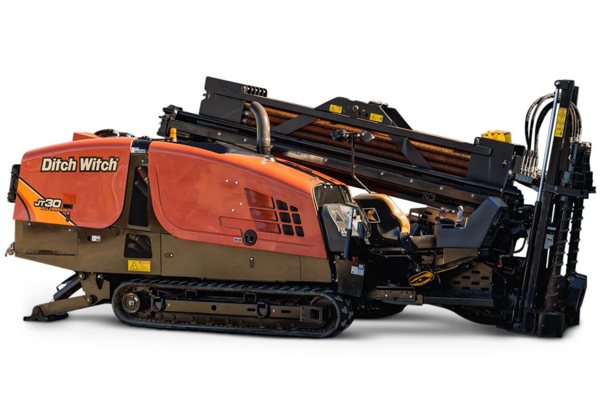 2016 Ditch Witch JT30 All Terrain HDD drill, side view, rubber tracks, loaded drill pipe rack, operator station, orange engine hood