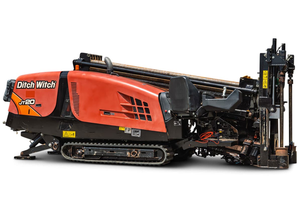 2021 Ditch Witch JT20 HDD drill, side 3/4 view, orange hood, rubber tracks, loaded drill pipe, operator controls, anchor system visible