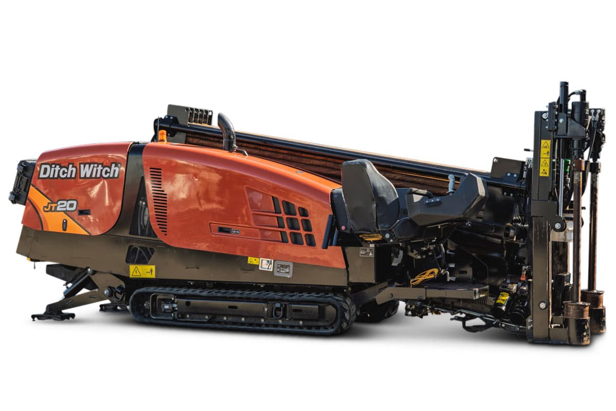 Ditch Witch JT20 HDD rig, side profile view showing tracked carrier, red/orange cab, drill head assembly, 17,000 lbs thrust, 2,200 ft-lb torque