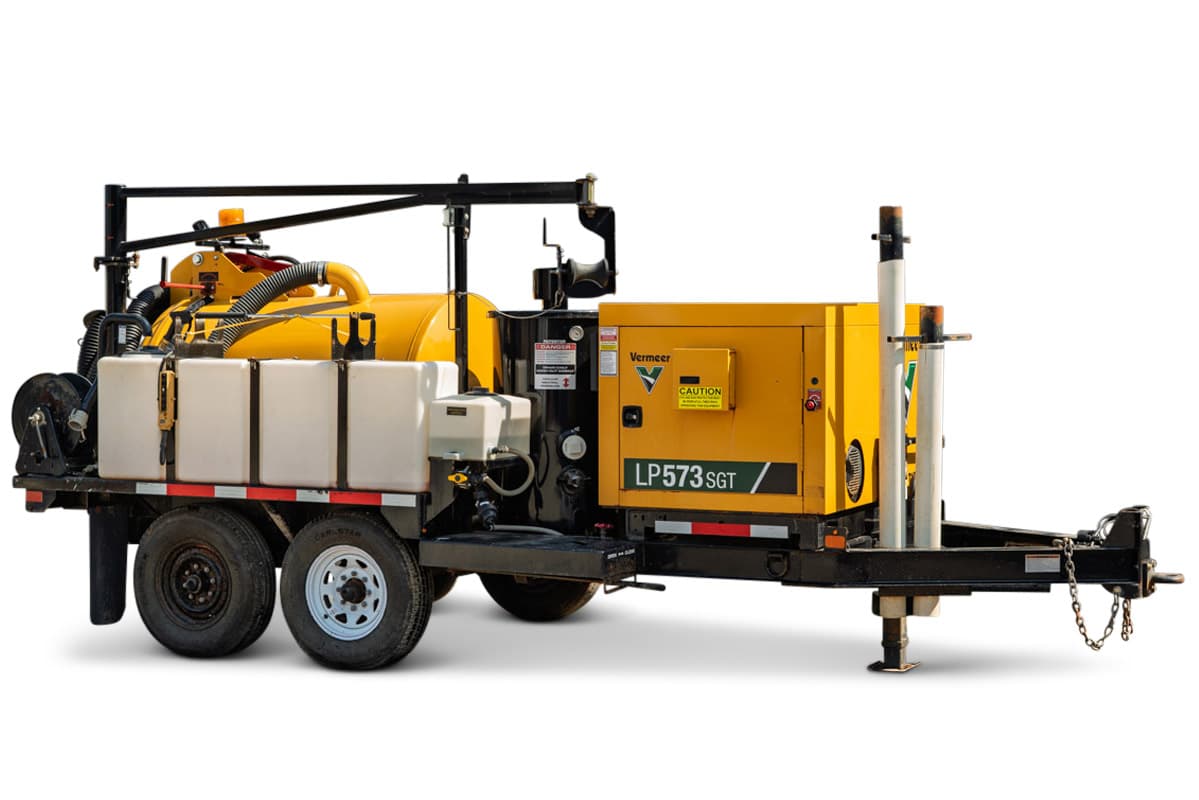 2024 Vermeer LP573SGT vacuum excavator, side profile showing trailer-mounted spoil tank, water tanks, and engine compartment.
