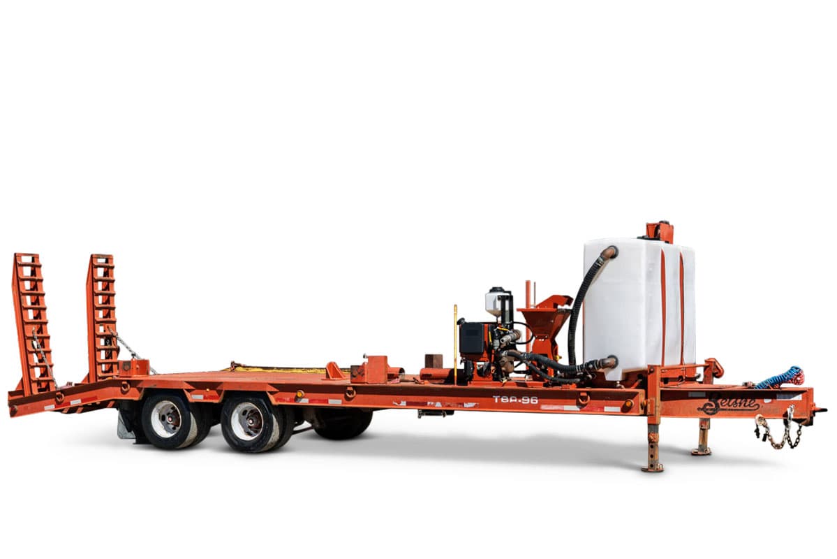 2020 Belshe T10 tag-along trailer, orange, tandem axle, fold-down ramps, mounted mud mixing system with white IBC tote and hopper