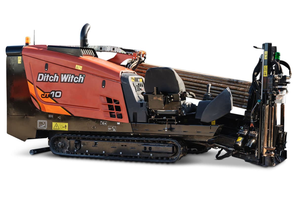 Ditch Witch JT10 HDD unit with tracked undercarriage, red/orange cab, drill pipe rack, and right-side pullback winch assembly, 66 hp, 9,000 lbs thrust capacity