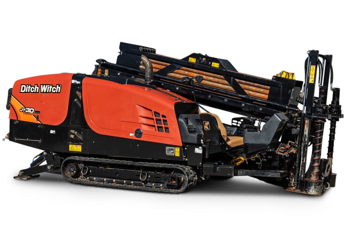 2017 Ditch Witch JT30 All Terrain HDD rig, 3/4 view, orange cab, rubber tracks, loaded pipe rack, drill rod, anchor system