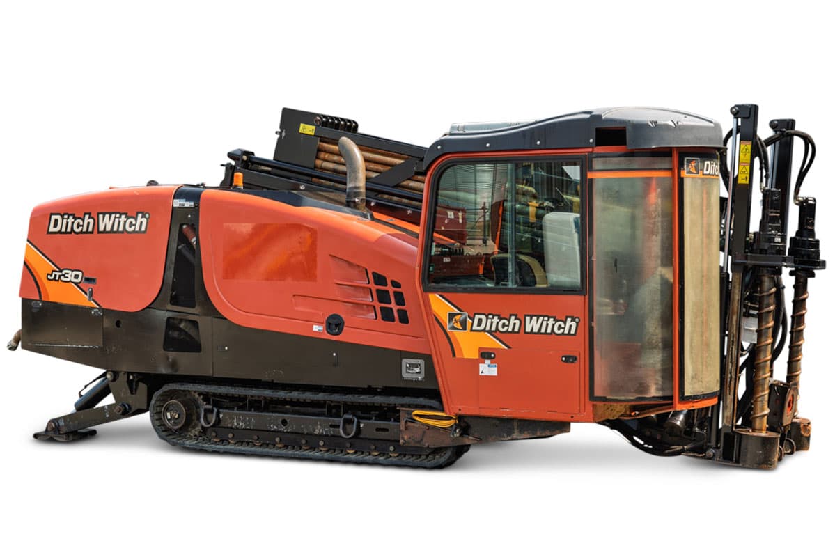2018 Ditch Witch JT30 HDD drill, side-angle view, enclosed cab, pipe rack loaded, carriage assembly, steel tracks, used condition