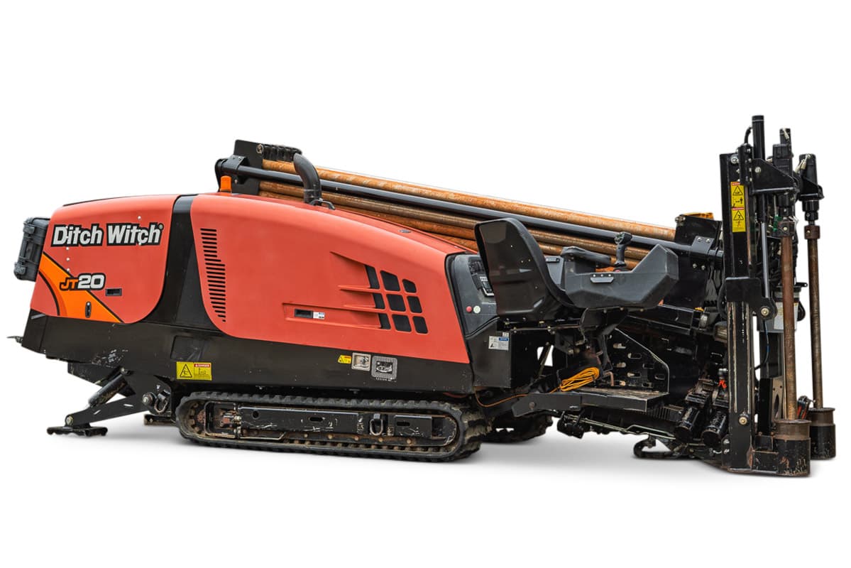 2018 Ditch Witch JT20 horizontal directional drill, side profile view showing tracks, engine housing, and drill pipe rack.