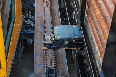 Vermeer 40x55DR S3 drill pipe rack and transmission components with rack teeth and gear assembly detail