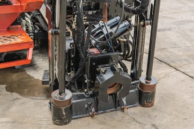 2021 Ditch Witch JT25 drill carriage, spindle, and hydraulic system detail. Close-up of rotation drive and anchor assembly.
