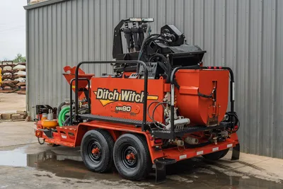 2015 Ditch Witch MR90 mud recycler, rear 3/4 view, tandem-axle trailer, mixing hopper, pump, hydraulic hoses, orange tanks