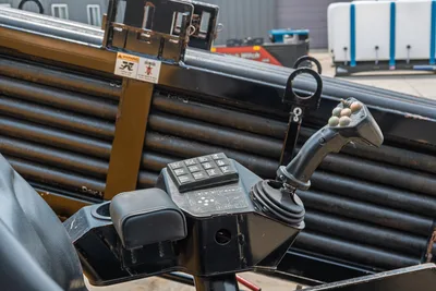 Vermeer 24x40 Series II operator station joystick, control console, and onboard drill pipe rack with rod loading system.