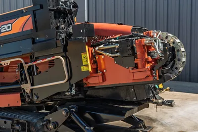 2018 Ditch Witch JT20 drill carriage and rack view, showcasing drive motor, hydraulic hoses, and crawler track base.