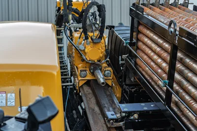 2019 Vermeer D40x55 S3 spindle, rotary drive, rack-and-pinion carriage, hydraulic hoses, and loaded drill pipe rack, overhead view
