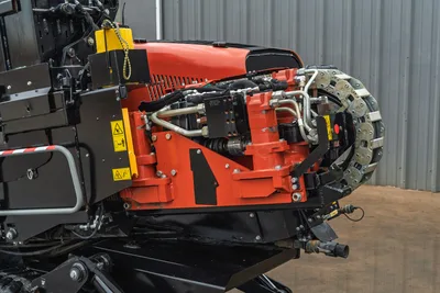 Ditch Witch JT20 HDD drill head with 2.06" drill pipe, 2,200 ft-lb torque, right-side close-up view showing rotary mechanism and hydraulic components.