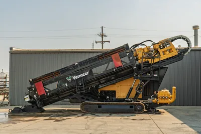 2017 Vermeer D100x140 S3 HDD drill, full side profile, carriage angled upward, drill pipe loaded, rubber tracks, yellow hydraulic components visible