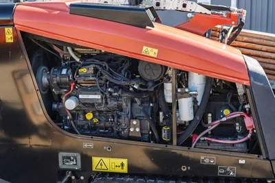 Ditch Witch JT10 engine compartment with 66 hp diesel engine, hydraulic systems, drill pipe storage, orange hood open