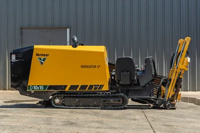 Vermeer D10x15 Navigator horizontal directional drill with yellow cab, tracked undercarriage, pullback winch arm, side profile view, excellent condition