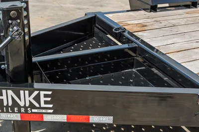 Behnke CBCT2324E-BT-R trailer rear toolbox closeup, black perforated steel tray with dividers, diamond plate trim, Behnke branding