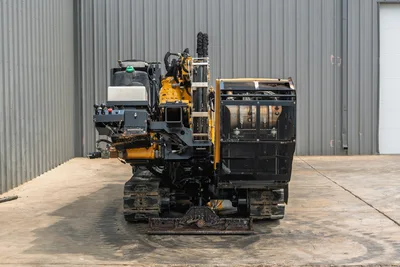 Rear view of 2014 Vermeer 24x40 Series II HDD drill showing engine compartment, track undercarriage, and operator station.
