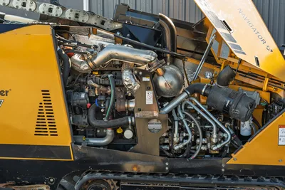 2021 Vermeer D23x30 S3 Navigator open engine compartment showing diesel engine, exhaust, hydraulic manifold, and hose bundle