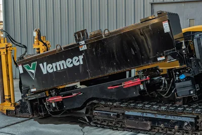 2019 Vermeer D40x55 S3 HDD drill carriage close-up showing black drill frame, Vermeer branding, rubber tracks, red handles, hydraulic lines