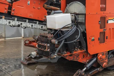 2008 Ditch Witch JT4020 MACH 1 mud pump, cooling fan, hydraulic hoses, and side chassis components detail view.