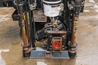 2018 Ditch Witch JT10 drill head, vise assembly, and rod loading alignment close-up showing hydraulic cylinders and vise.