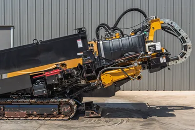 2019 Vermeer D40x55 S3 HDD drill frame angled up, showing carriage, spindle, hydraulic hoses, cable chain, and rubber tracks.
