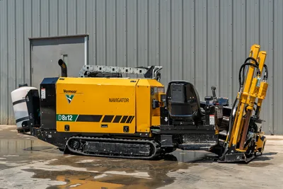 2021 Vermeer D8x12 Navigator HDD drill, side profile, yellow engine enclosure, rubber tracks, operator console, drill frame raised