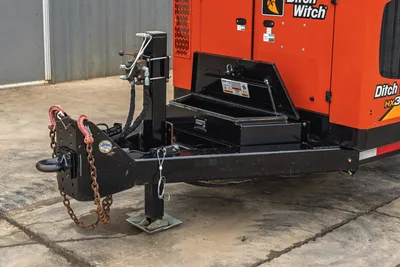 2019 Ditch Witch HX30 vacuum excavator tongue, hitch assembly, safety chains, and open storage compartment.