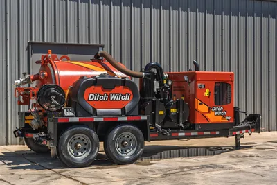 2023 Ditch Witch HX30 mud recycler, trailer-mounted, tandem axle, orange vacuum tank, engine compartment, suction hose, rear 3/4 view