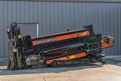 2023 Ditch Witch JT20 horizontal directional drill, side profile view showing rack, drill pipe, tracks, and engine housing.