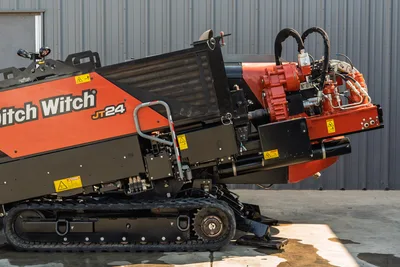 2020 Ditch Witch JT24 side profile showing rubber tracks, engine compartment, carriage assembly, and hydraulic connections.