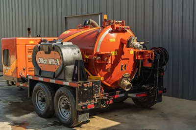 2022 Ditch Witch HX30 vacuum excavator trailer, rear 3/4 view, orange debris tank, hose reel, tandem axle, used condition