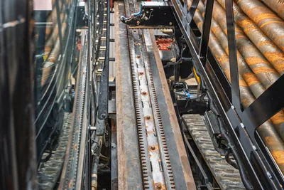 Ditch Witch AT40 rack and pinion drill carriage, pipe rack, and tracks viewed from above.