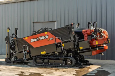 2020 Ditch Witch JT24 directional drill, side profile showing tracks, drill head, hydraulic hoses, and engine compartment.