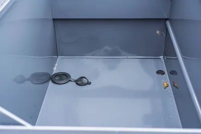 Behnke TBCT2220ET-BT-R trailer interior storage compartment floor with drain plugs, flush pull rings, and keys