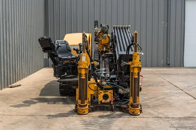 2014 Vermeer 24x40 Series II HDD drill rig, rear view showing operator seat, stabilizer legs, and drill pipe rack.