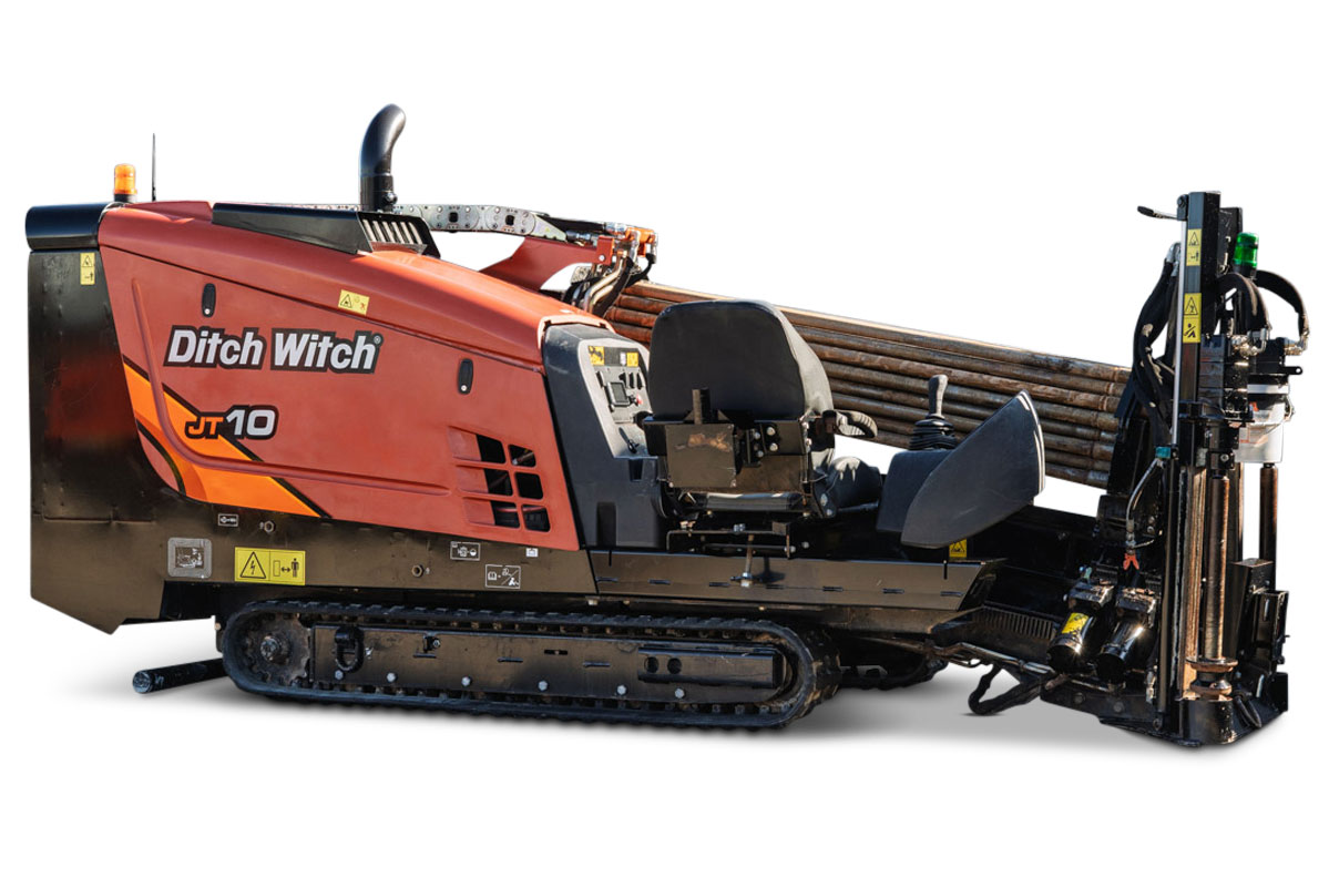 Ditch Witch JT10 HDD unit with tracked undercarriage, red/orange cab, drill pipe rack, and right-side pullback winch assembly, 66 hp, 9,000 lbs thrust capacity