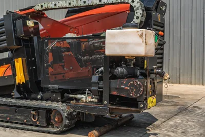 2018 Ditch Witch JT10 HDD rig, rear quarter view showing engine compartment, fluid reservoir, and rubber track undercarriage.