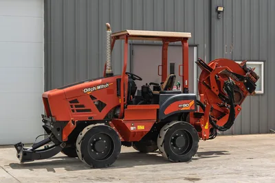 2017 Ditch Witch RT80 riding trencher, profile view, showing tires, open canopy, rear-mounted boom, and clean engine hood.