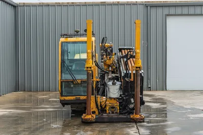 Front view of Vermeer 40x55 S3 HDD rig showing drill cab, stabilizer jacks, pipe rack, and hydraulic drill pipe assembly.
