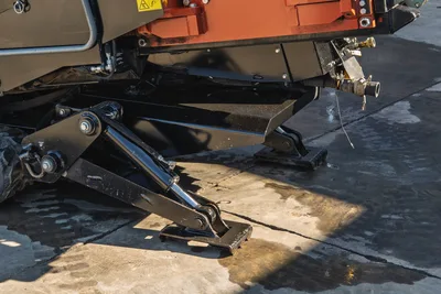 Ditch Witch JT20 HDD drill head assembly with rotary drive, 2.06" drill pipe, and hydraulic controls from side angle