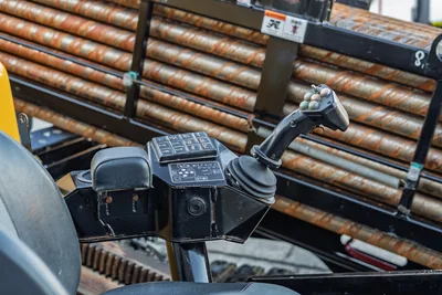 2019 Vermeer D40x55 S3 operator controls with joystick, function keypad, and loaded drill pipe rack visible in background