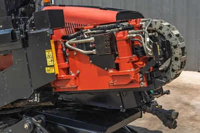2017 Ditch Witch JT20 drill carriage close-up showing drive chain, hydraulic lines, and thrust frame in good condition