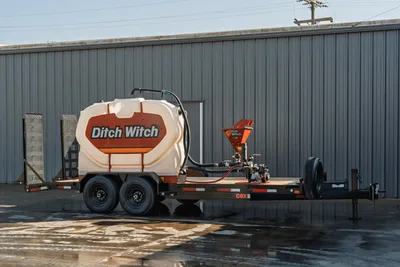 2023 MAXX-D C6X tandem-axle mud trailer, Ditch Witch water tank, bentonite mixer, pump assembly, flatbed deck, side profile view.