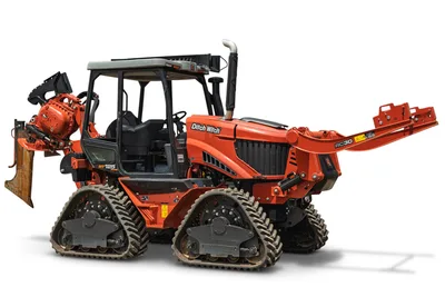 2024 Ditch Witch RT125Q quad-track trencher with RC30 attachment, vibratory plow, enclosed cab, side 3/4 view