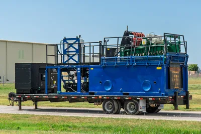 2023 American Augers M300DH mud recycling system on trailer, driver-side view, blue tank, shaker deck, generator, pump skid