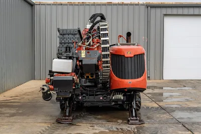 2021 Ditch Witch JT40 HDD drill, rear view showing drill pipe rack, hydraulic lines, engine hood, anchors, and tracks