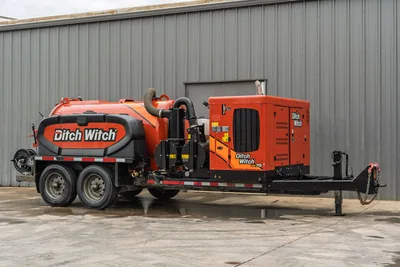 2023 Ditch Witch HX75 mud recycler on tandem-axle trailer, side view showing orange mixing tank, pump assembly, and engine enclosure